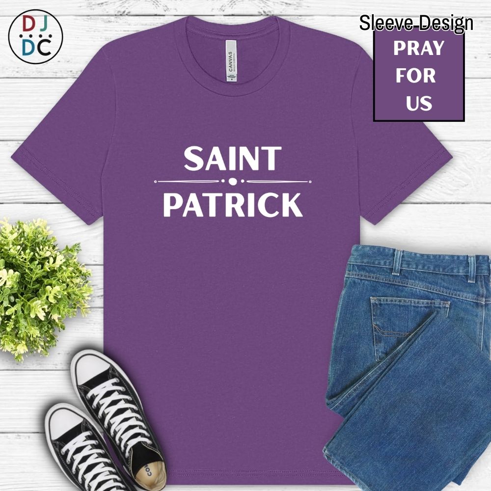 Purple t-shirt with 'Saint Patrick' text, paired with jeans and sneakers on a wooden surface.