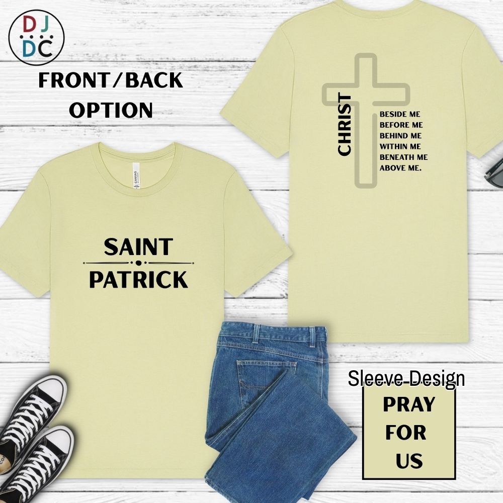 Light yellow-green t-shirt with 'Saint Patrick' and 'Christ' design on a wooden surface with jeans and sneakers.